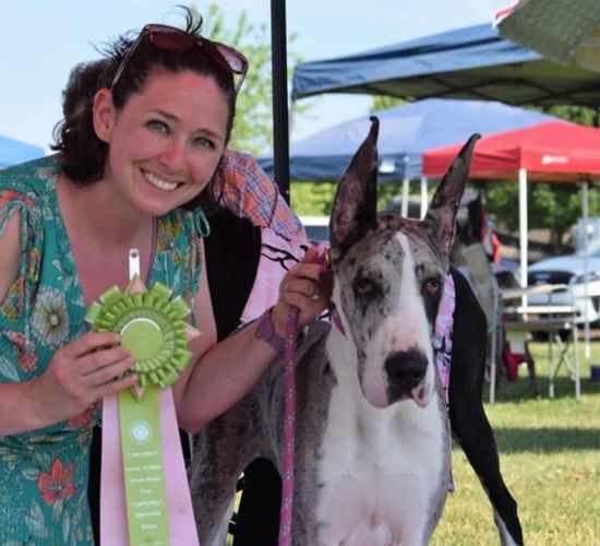 woman and dog at show